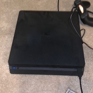 PS4 1TB slim console and one game mk11 dual shock one controller.